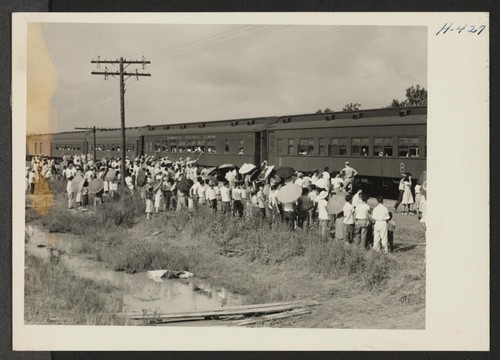 Closing of the Jerome Center, Denson, Arkansas. Scene as one train of 500 Jerome residents leaves for the Gila River Center. Photographer: Mace, Charles E. Denson, Arkansas