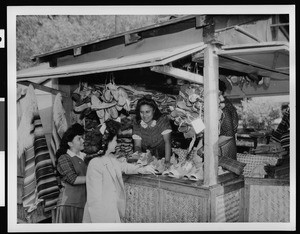 Olvera Street merchants with their crafted shoes, ca.1930-1939