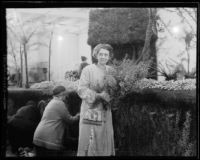 Georgia Chobe, designer of the "Hansel and Gretel" Rose Parade float, directing its decoration, Pasadena, 1933
