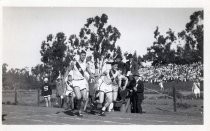 Stanford University track team members in competition
