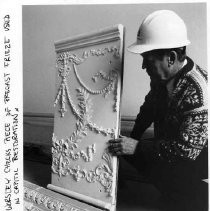 John Worsley, project architect for the California State Capitol building restoration, checks a piece of the precast frieze used in the project