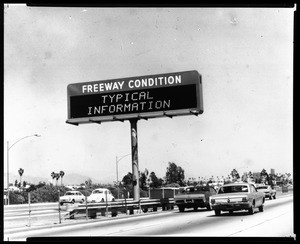 Electric freeway communication sign westbound on the Santa Monica Freeway showing traffic conditions on May 23, 1973