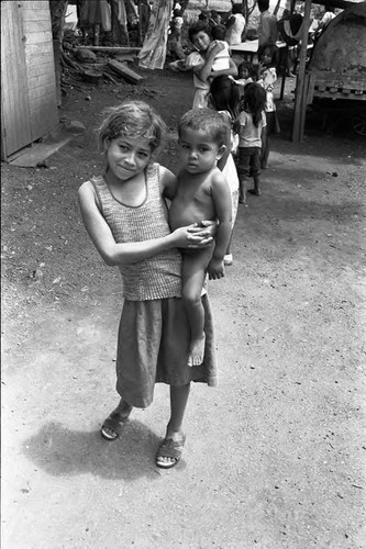 Young girl holding a baby, Costa Rica, 1979