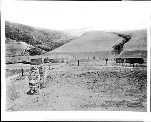 View of the ruins of the first La Purisima Concepcion Mission, showing a large earthquake crack on the hill in the background, ca.1898