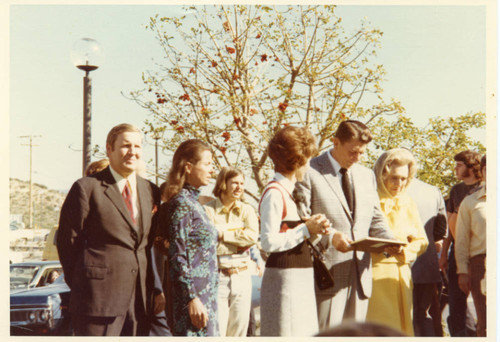 Governor Reagan reading the plaque. Nancy Reagan to the L; Mrs.Brock to the R