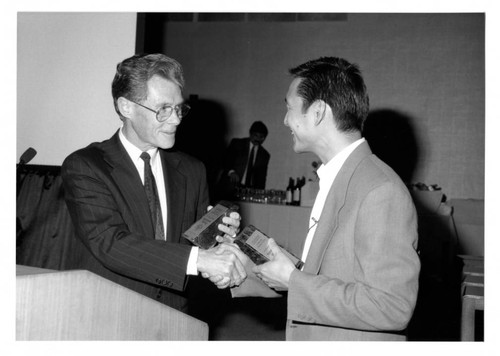 Woodbury University President Ken Nielsen Presents Kenneth P. Wong with a Trophy