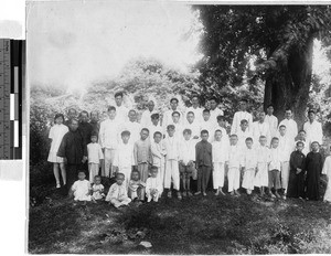Group of Catholics standing under a tree, Kaying, China, ca. 1930