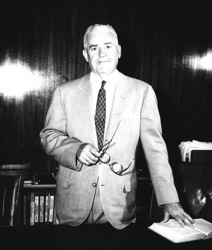 Portrait of President Glenn Kendall at his desk