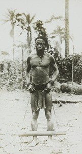 Man in stocks, Congo, ca. 1900-1915