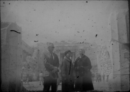 Alice Peters with unidentified man and woman standing in front of unidentified ruins
