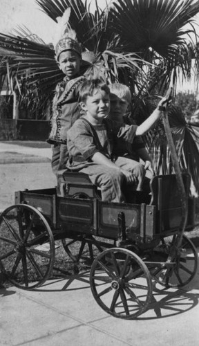 Children in toy wagon