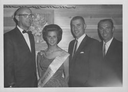 Miss Rohnert Park with 3 men at the Green Mill Inn, Cotati, California, 1962