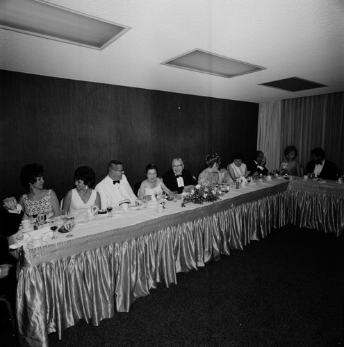 UCSD Chancellor William J. (William James) McGill (middle) at the head table during the UCSD Faculty Ball. April 25, 1970