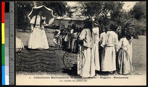 Local missionaries gathered around a missionary sister for a lesson, Nagpore, India, ca.1920-1940