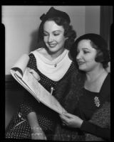Actress Alice Moore with and her mother, Alice Joyce, look at Ms. Moore's acting contract, Long Beach, 1935