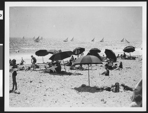 People on the sand at a Los Angeles area beach, ca.1930