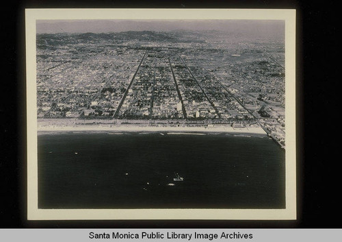 Aerial of the Santa Monica shoreline from the ocean with the Crocker Bank Building in center foreground, Santa Monica, Calif. on October 17, 1933