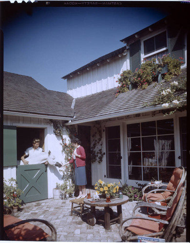 [Unidentified residential exteriors and landscaping]. Horse, woman and Outdoor living space