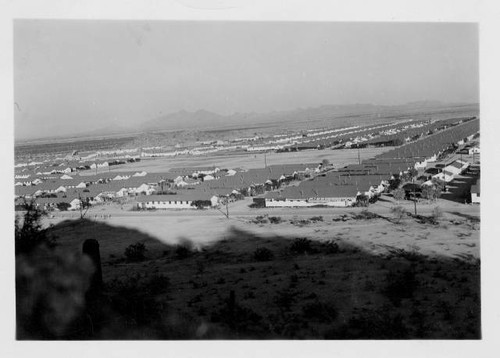 Aerial view of Gila River Relocation Center with mountains in background