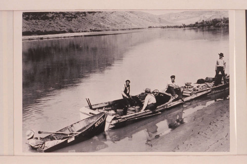 Nevills in one of the Monument Valley-Rainbow Bridge Expedition's Fol-Flat boats which he used in the trip from Moab down to near the Junction