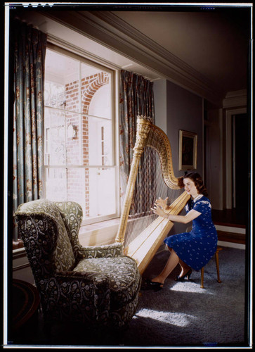 Durbin, Deanna, residence. Deanna Durbin playing the harp