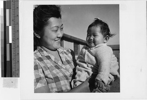 Woman and child at Granada Japanese Relocation Camp, Amache, Colorado, December 12, 1942