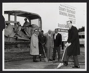 Hahn and others with shovels and bulldozer