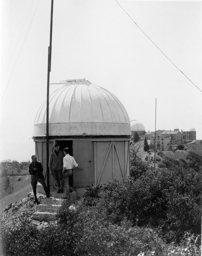 Three men outside a dome at Lick Observatory