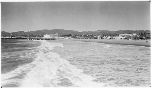 Beach and waves looking north to the Ocean Park Pier and Santa Monica Pier