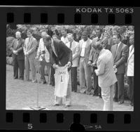 Kareem Abdul-Jabbar presenting No. 1 Laker jersey to President Ronald Reagan, 1985