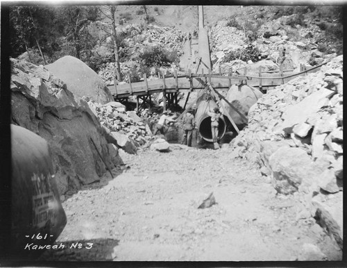 A construction crew placing a siphon pipe at Kaweah #3 Hydro Plant