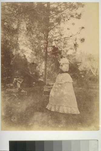 [Unidentified man and woman with piglet. Shebley Park?]