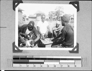 Men playing a board game, Msangano, Tanzania, 1937