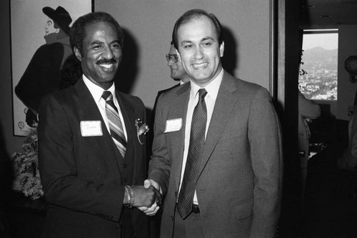 Don Bohana posing with an unidentified man at an event, Los Angeles, 1983