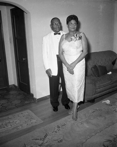 African American couple in formal dress posing together, Los Angeles