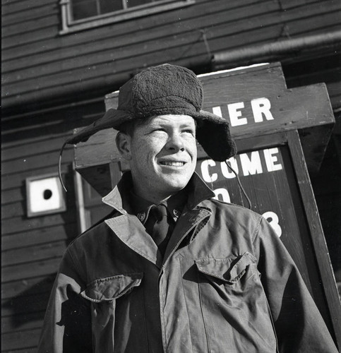 Soldier posing in front of podium at Camp Drake in Japan