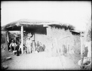 Chemehuevi Indian family at their dwelling, ca.1900