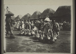 Palm Wine and masked dancers at the Sowing Festival