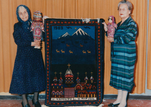 Armenian women with carpet