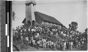 Large group of people standing outside a chapel, Borneo, 1927