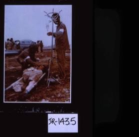 Poster depicting Iranian soldiers caring for wounded comrade