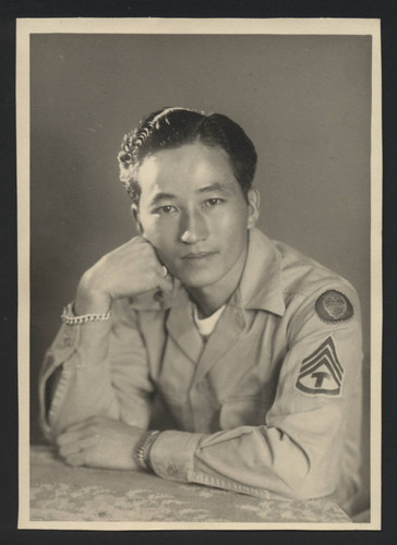 Portrait of soldier with military patch on sleeve