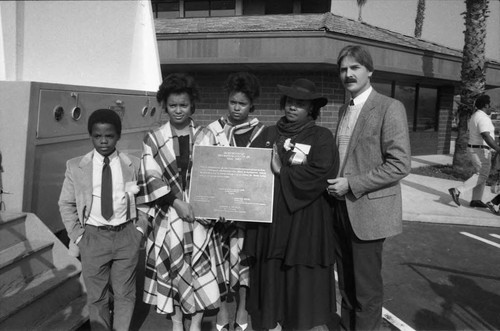 Participants posing at the opening of the Martin Luther King Jr. Shopping Center, Los Angeles, 1984