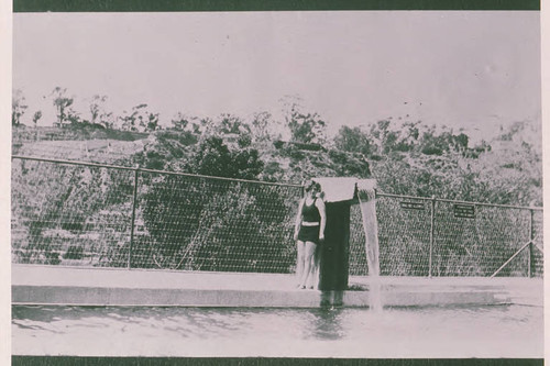 Betty Bundy posing next to a swimming pool