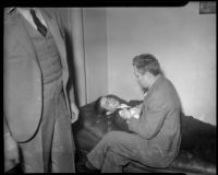 Louis Rude Payne lies on couch, with father Lucius Payne at his side. June 5, 1934