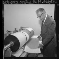 Dr. Charles Richter analyzing a seismograph log in Los Angeles, Calif., 1964