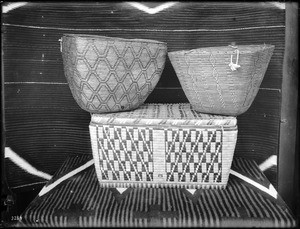 Three Indian baskets on display, ca.1900