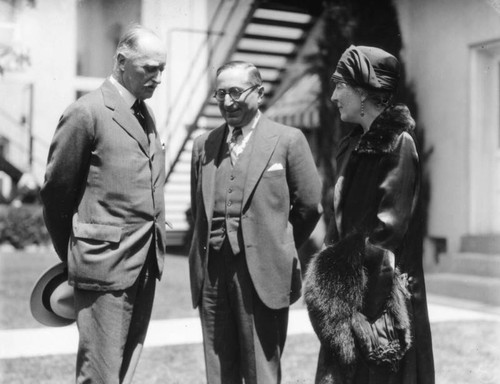 Louis B. Mayer chats with Sir Esme Howard and wife