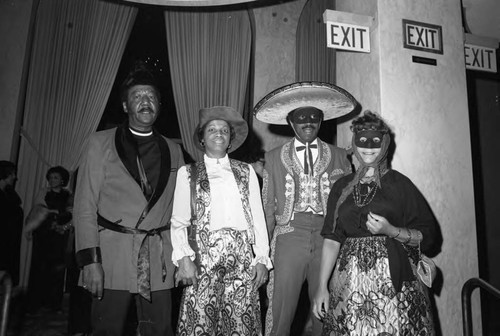 Participants at a benefit dance for the International Children's School posing together, Los Angeles, 1974