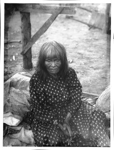 Yokut Indian woman sitting outside, Tule River Reservation near Porterville, California, ca.1900